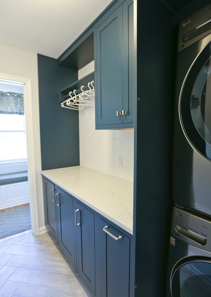 This is an example of a mid-sized midcentury single-wall dedicated laundry room in DC Metro.