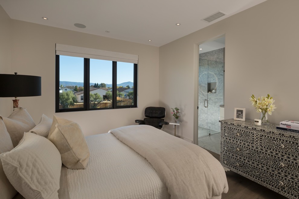 Example of a huge trendy guest light wood floor and brown floor bedroom design in San Francisco with beige walls