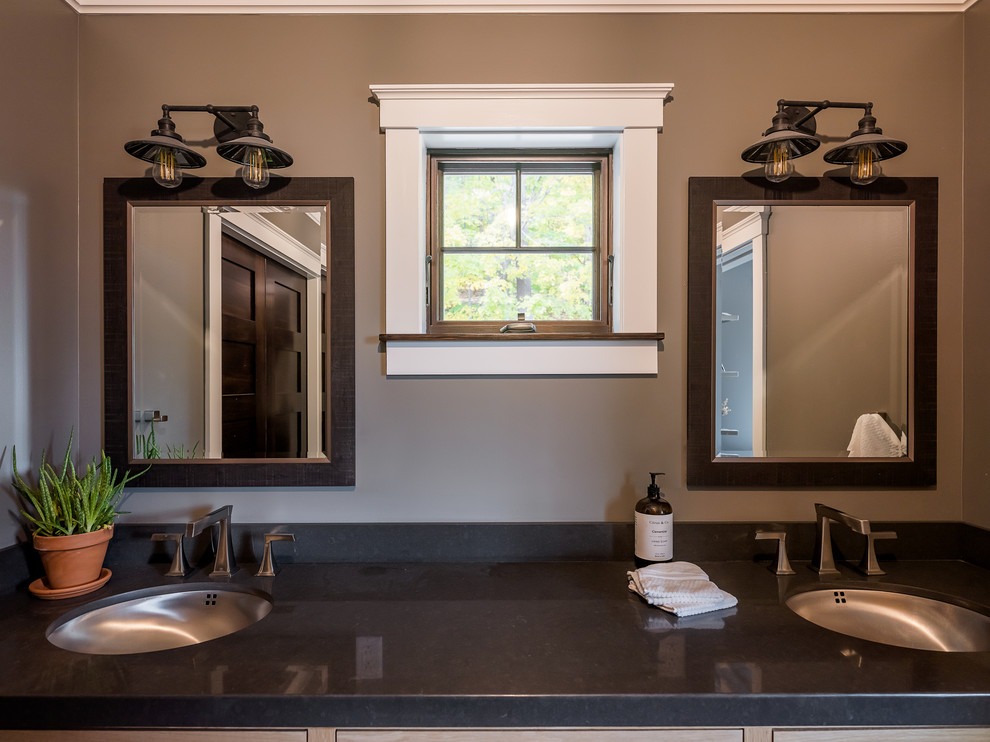 Inspiration for a large country master bathroom in New York with beaded inset cabinets, beige cabinets, grey walls, a drop-in sink, marble benchtops and black benchtops.