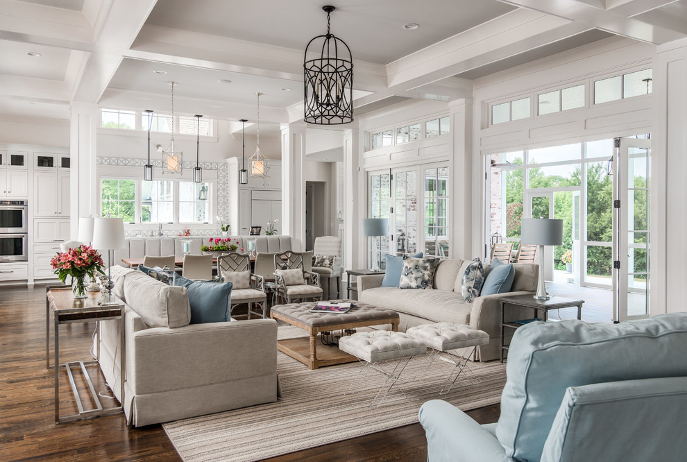 Inspiration for a transitional open concept living room in Nashville with white walls, dark hardwood floors, a standard fireplace, a stone fireplace surround and brown floor.