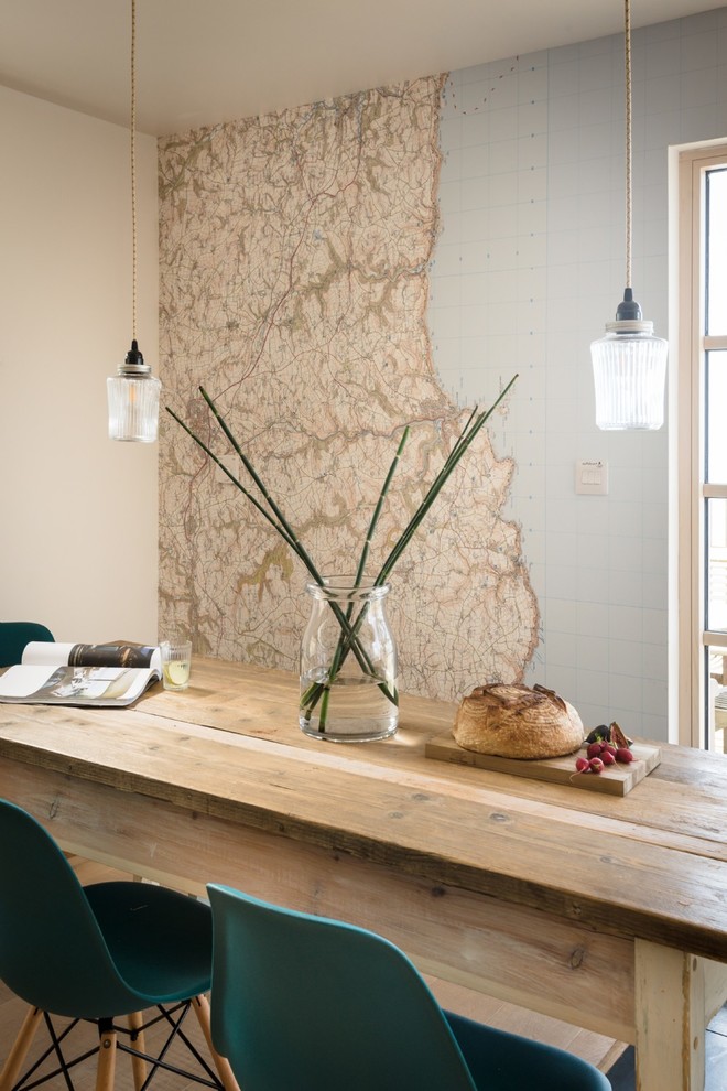 Design ideas for a mid-sized scandinavian dining room in Cornwall with beige walls.