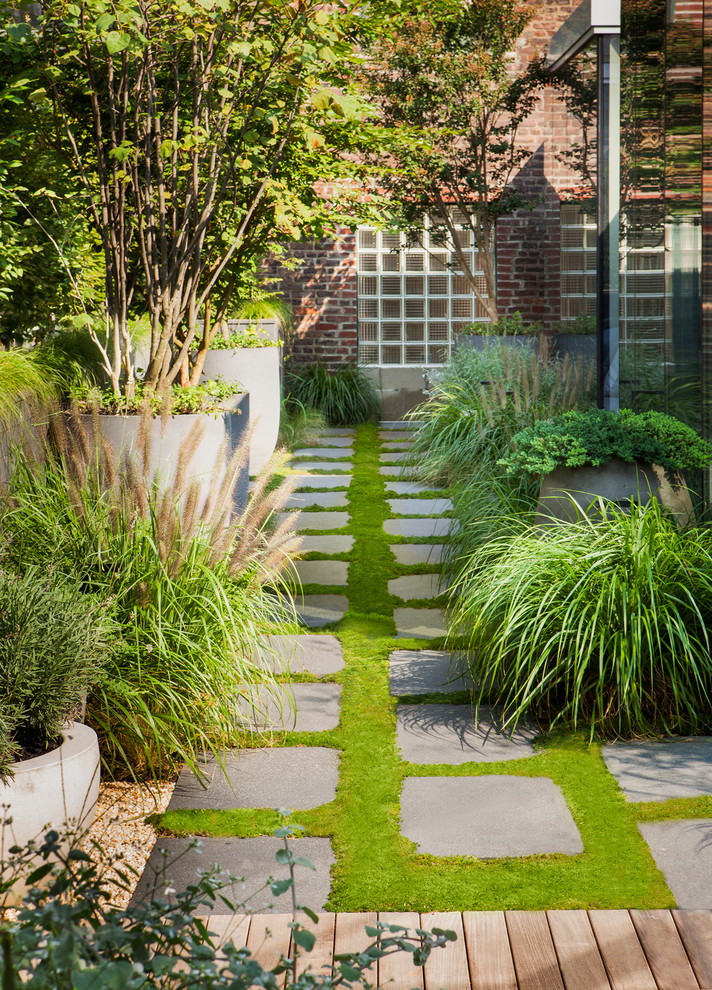 Photo of a contemporary garden in New York with a garden path.