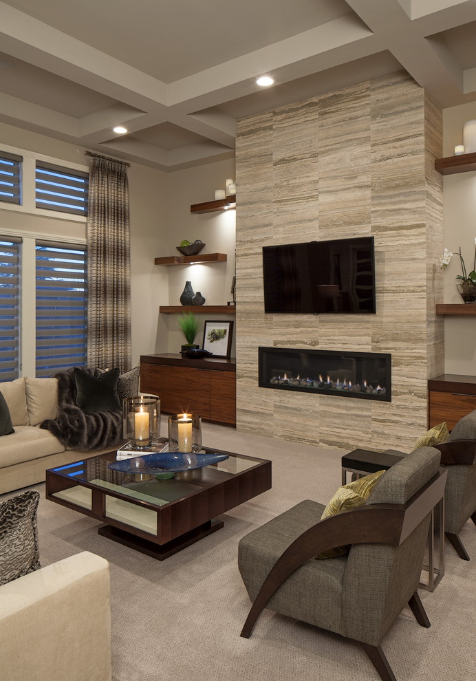 This is an example of a contemporary living room in Omaha with carpet, a ribbon fireplace, a wall-mounted tv and beige walls.