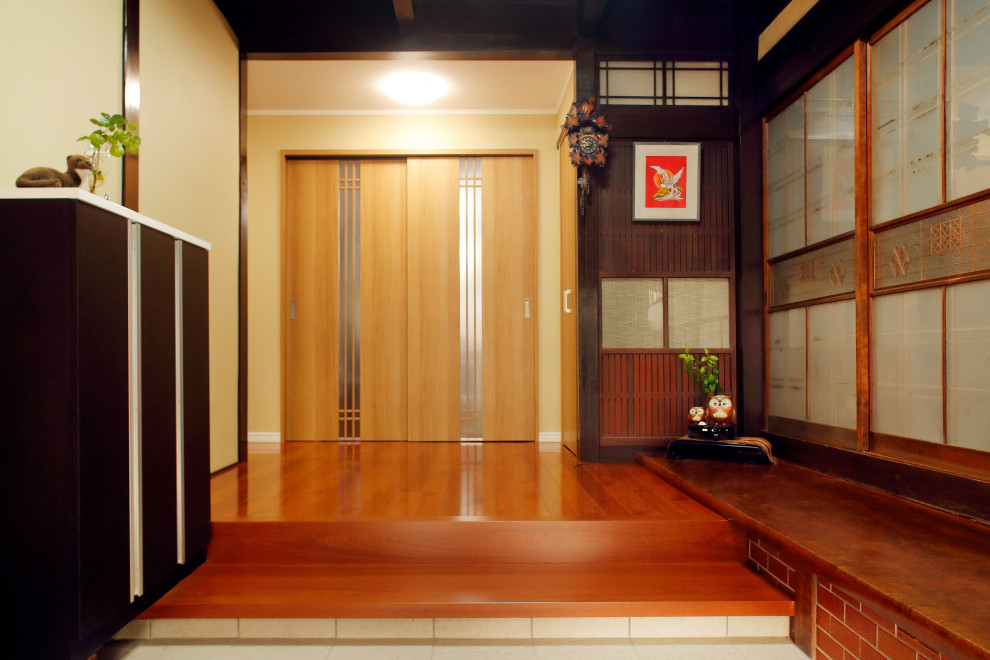 Large modern entry hall in Other with beige walls, plywood floors, a double front door, a brown front door, brown floor, wallpaper and wallpaper.