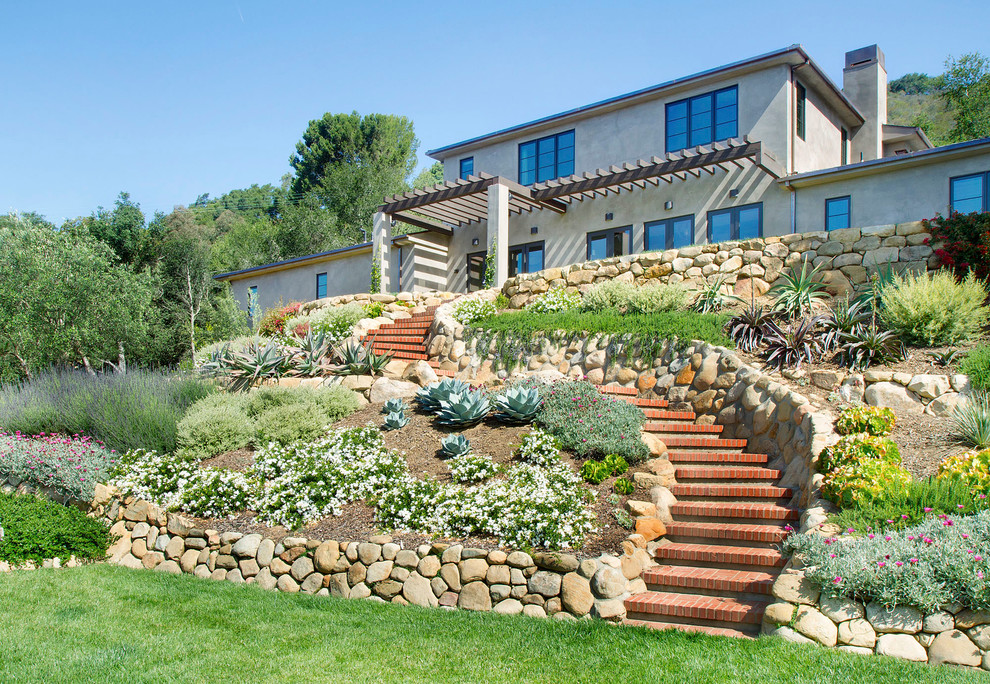 This is an example of a mediterranean backyard garden in Santa Barbara.