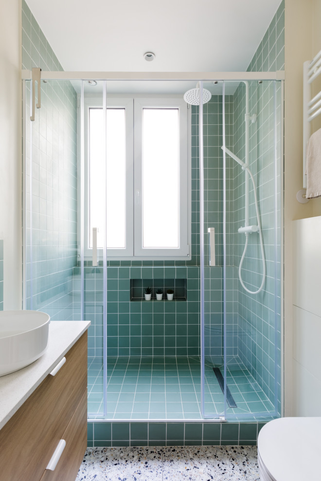 Mid-sized scandinavian 3/4 bathroom in Paris with an open shower, a wall-mount toilet, green tile, ceramic tile, white walls, terrazzo floors, a drop-in sink, quartzite benchtops, a sliding shower screen, white benchtops, a single vanity and a floating vanity.