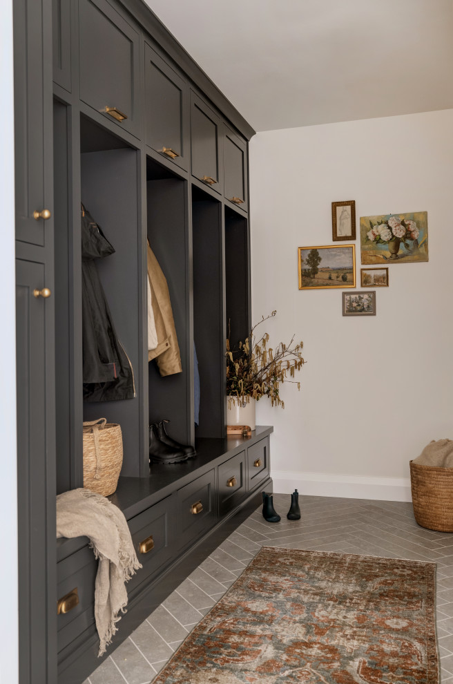 Inspiration for a transitional beige floor mudroom remodel in Seattle with beige walls