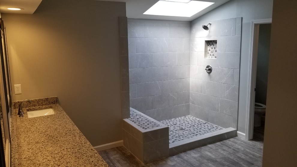 Design ideas for a modern bathroom in Atlanta with a corner shower, gray tile, slate, grey walls and an open shower.