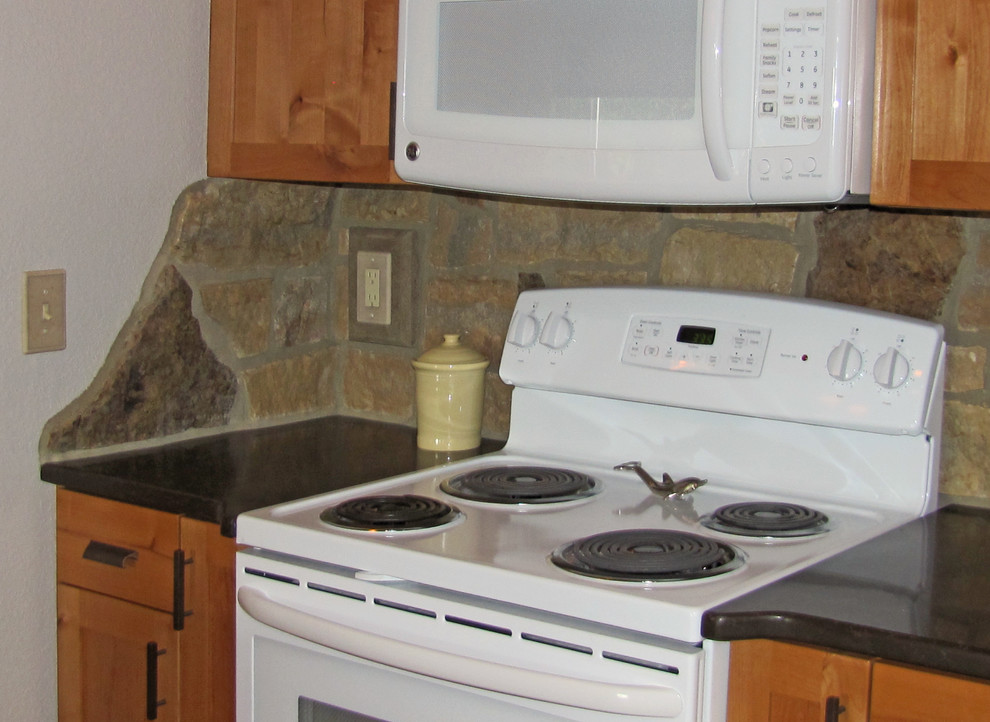 Inspiration for a large rustic u-shaped medium tone wood floor open concept kitchen remodel with an undermount sink, shaker cabinets, medium tone wood cabinets, quartzite countertops, gray backsplash, stone tile backsplash and an island