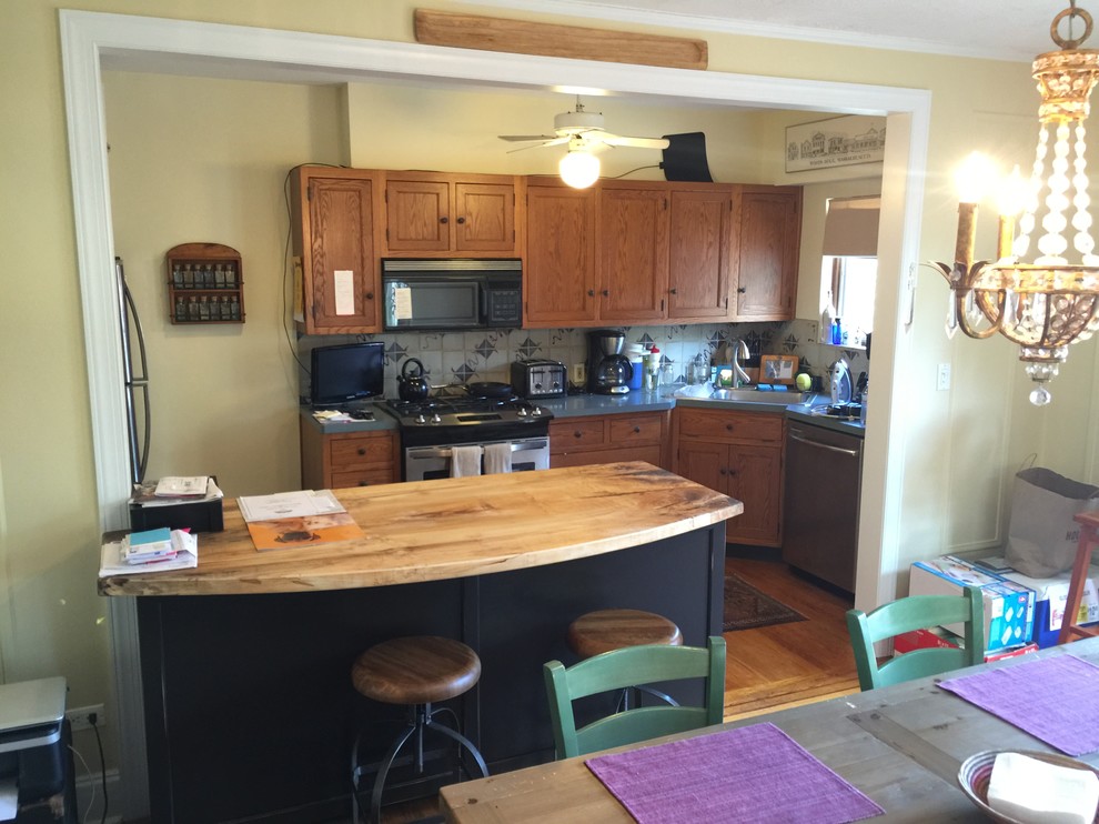 Eat-in kitchen - mid-sized transitional galley light wood floor eat-in kitchen idea in Baltimore with flat-panel cabinets, brown cabinets, wood countertops and an island