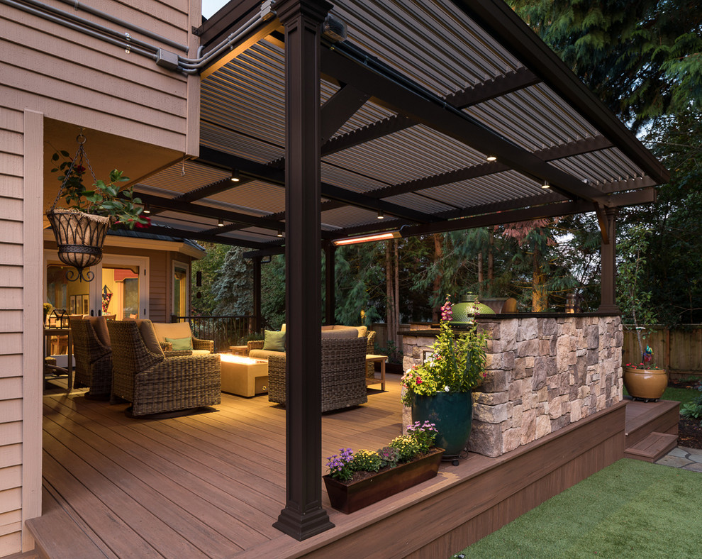 Design ideas for a large transitional backyard deck in Seattle with an outdoor kitchen and a pergola.