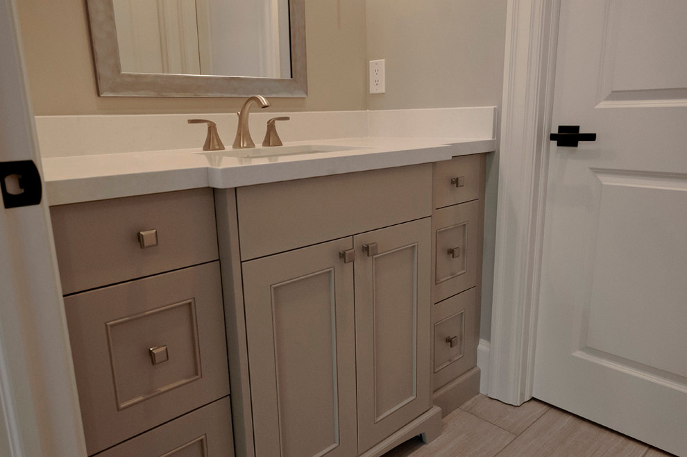 This is an example of a mid-sized transitional 3/4 bathroom in Salt Lake City with shaker cabinets, grey cabinets, grey walls, porcelain floors, an undermount sink, engineered quartz benchtops, grey floor and white benchtops.