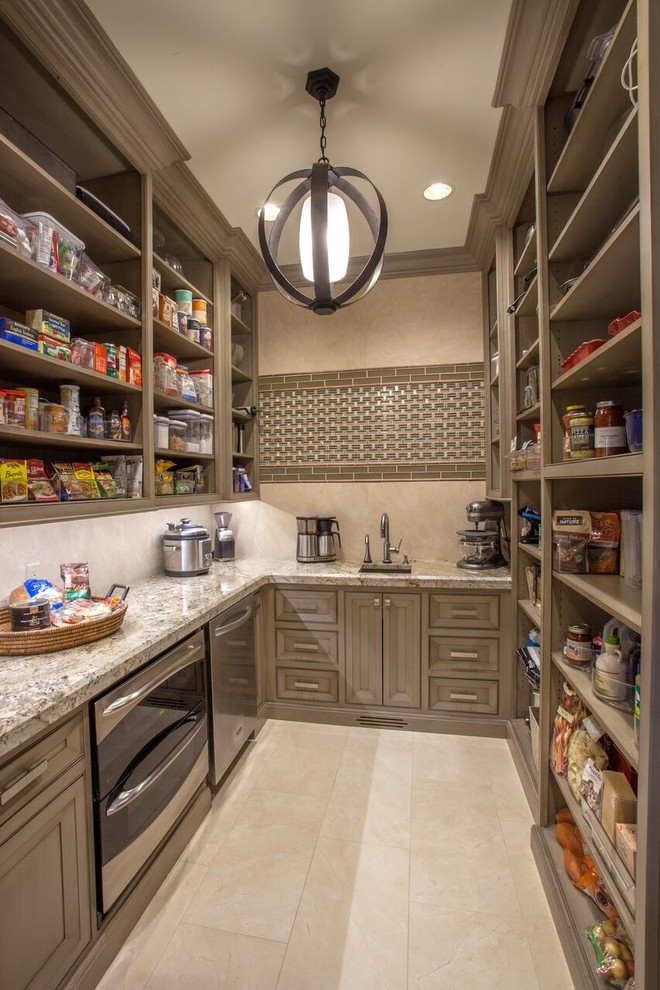 Example of a large transitional medium tone wood floor open concept kitchen design with recessed-panel cabinets, gray cabinets, granite countertops, beige backsplash, paneled appliances and an island
