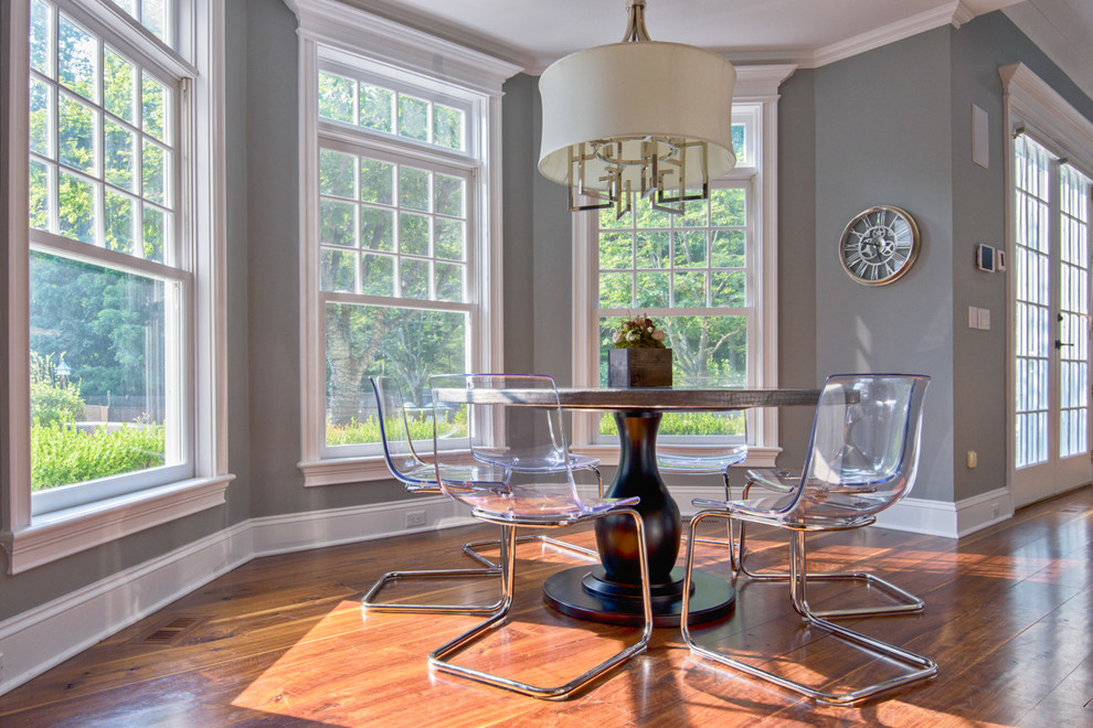 Mid-sized transitional open plan dining in New York with grey walls and medium hardwood floors.
