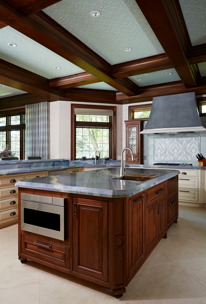Inspiration for a timeless kitchen remodel in Minneapolis with raised-panel cabinets, multicolored backsplash, stainless steel appliances and an island