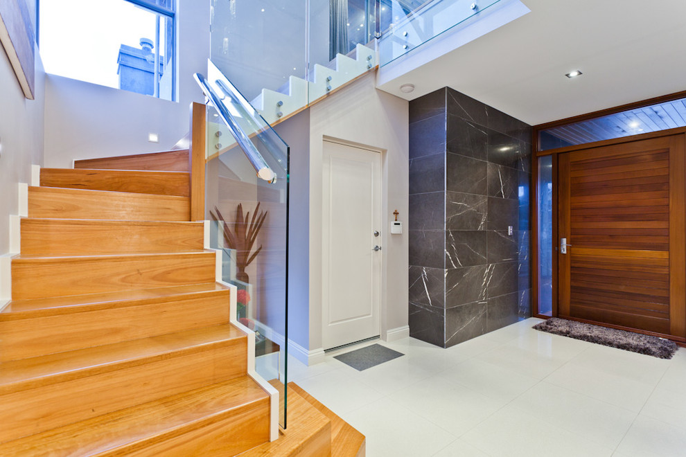 This is an example of a contemporary entryway in Perth with white walls.