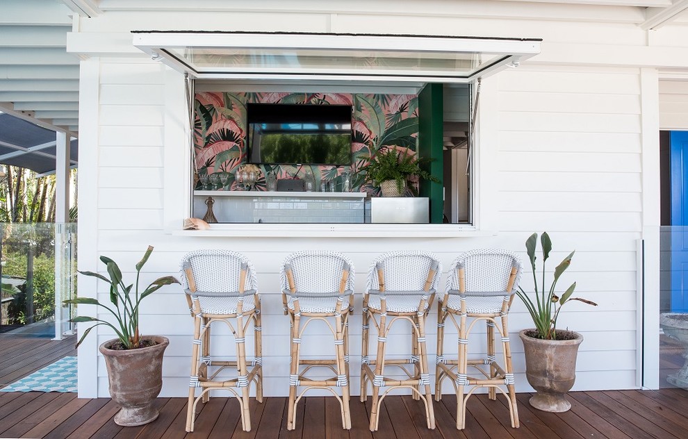 Small beach style galley seated home bar in Sunshine Coast with a drop-in sink, shaker cabinets, white cabinets, quartz benchtops, white splashback, subway tile splashback, marble floors and white benchtop.
