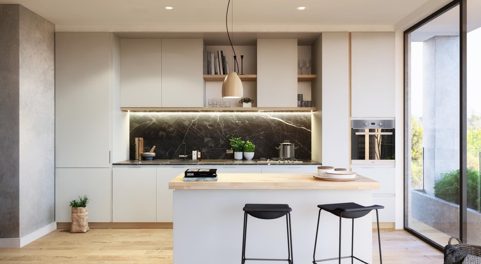 Photo of a mid-sized contemporary single-wall open plan kitchen in Melbourne with a double-bowl sink, white cabinets, quartz benchtops, multi-coloured splashback, stone slab splashback, stainless steel appliances and with island.