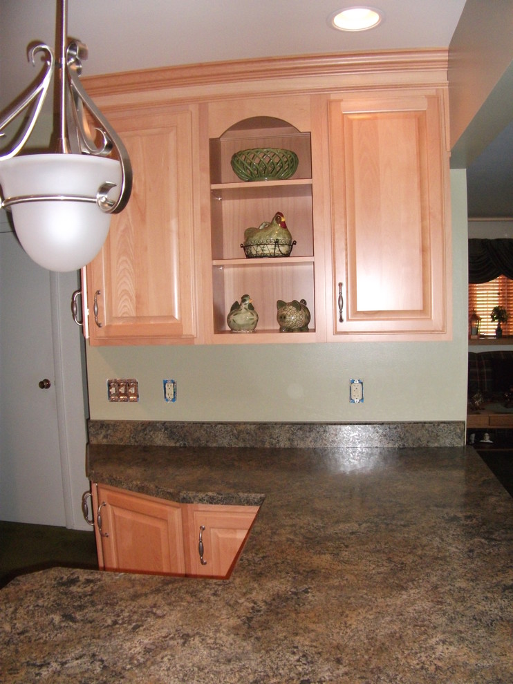 Kitchen - traditional vinyl floor kitchen idea with a drop-in sink, raised-panel cabinets, light wood cabinets, laminate countertops, green backsplash and white appliances