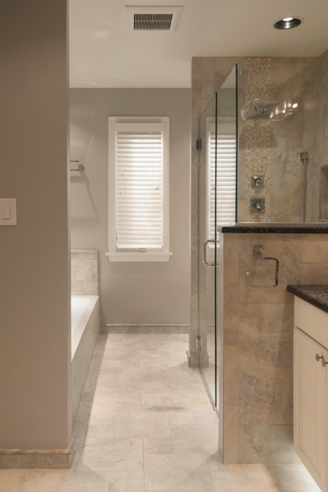 Example of a large trendy master beige tile and porcelain tile porcelain tile, beige floor and double-sink bathroom design in Other with raised-panel cabinets, white cabinets, a two-piece toilet, beige walls, an undermount sink, granite countertops, a hinged shower door, black countertops, a niche and a freestanding vanity