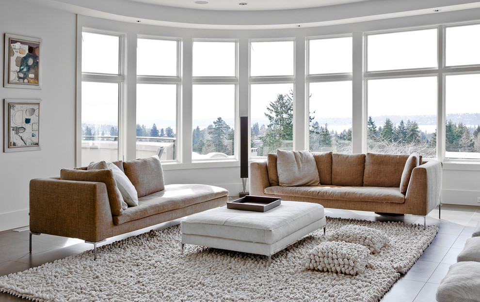 This is an example of a large contemporary living room in Seattle with white walls.