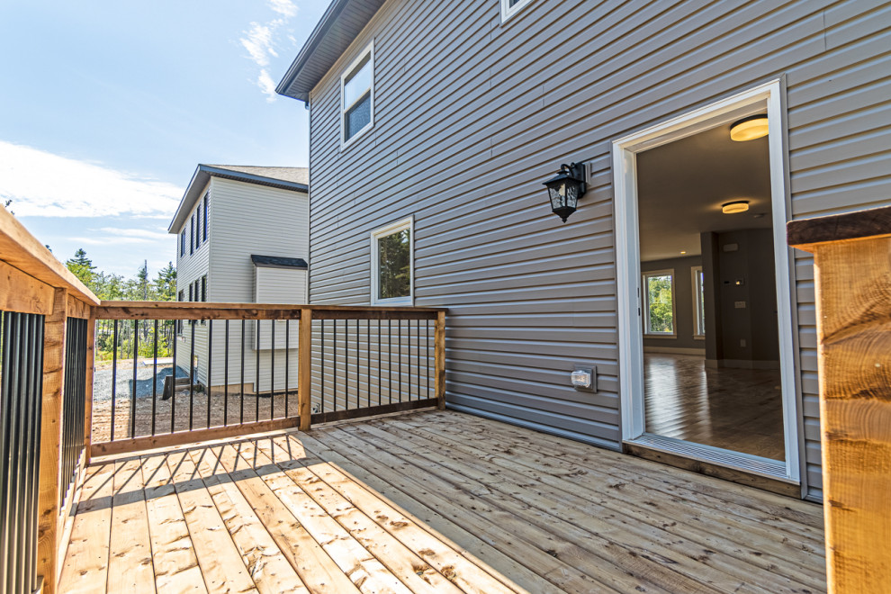 Example of a mid-sized transitional backyard deck design
