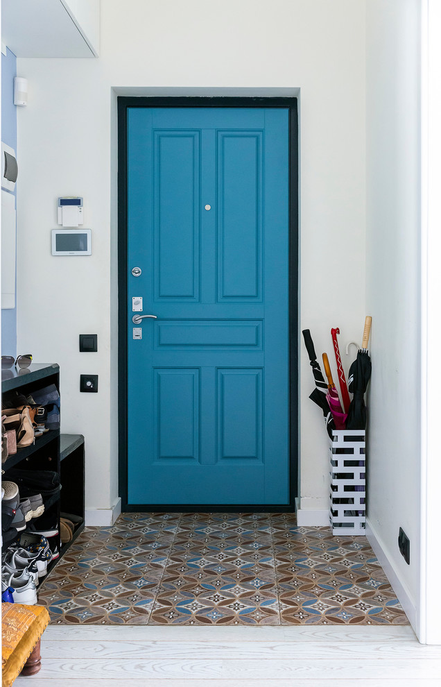 Mid-sized scandinavian front door in Moscow with white walls, ceramic floors, a single front door, a blue front door and multi-coloured floor.