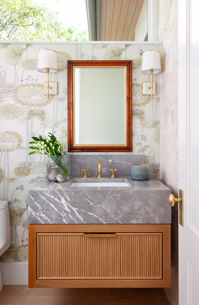 Transitional powder room photo in Austin
