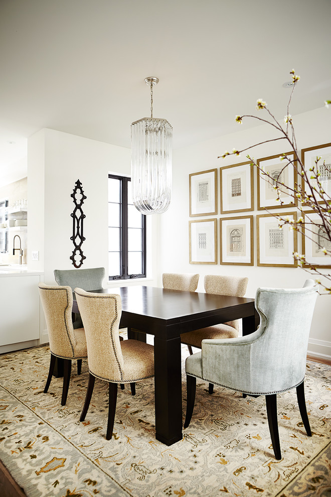 Inspiration for a transitional dining room in Toronto with white walls and dark hardwood floors.