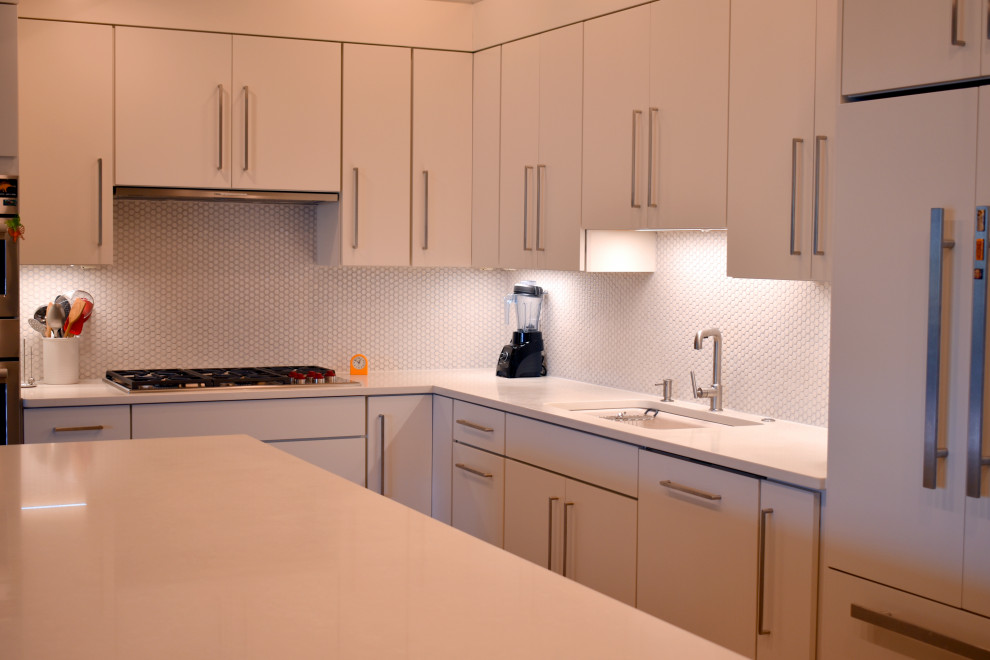 Photo of a large contemporary l-shaped open plan kitchen in Boston with flat-panel cabinets, white cabinets, quartz benchtops, white splashback, mosaic tile splashback, with island and yellow benchtop.