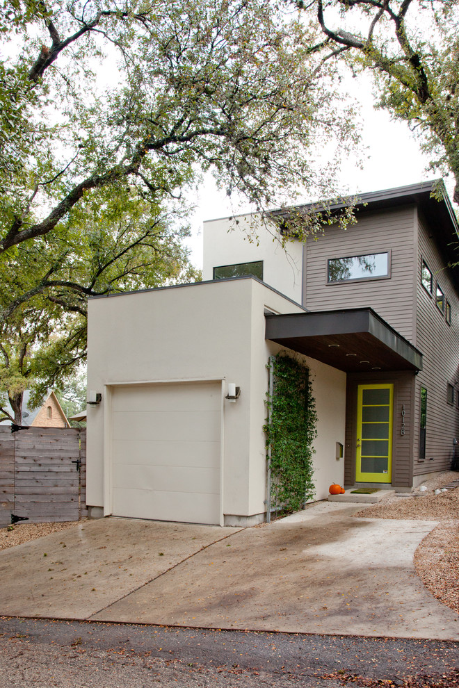 Photo of a contemporary two-storey grey exterior in Austin.