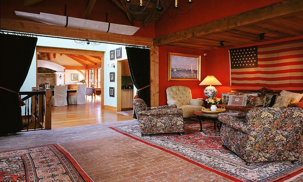 Photo of a large traditional enclosed living room in Boston with red walls, brick floors, no fireplace and no tv.