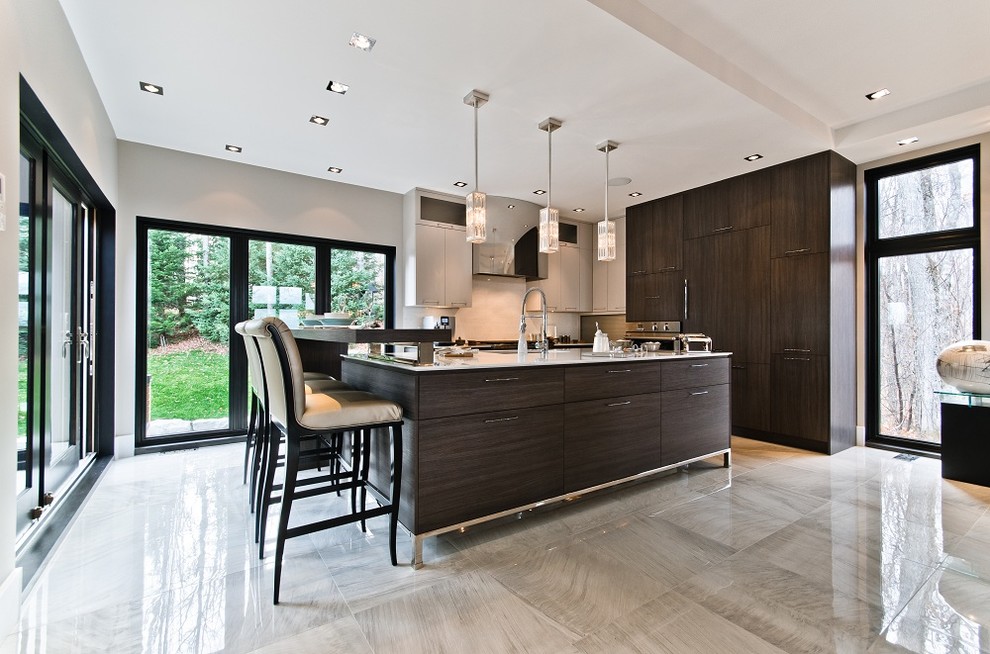 Inspiration for a contemporary kitchen in Montreal with panelled appliances.