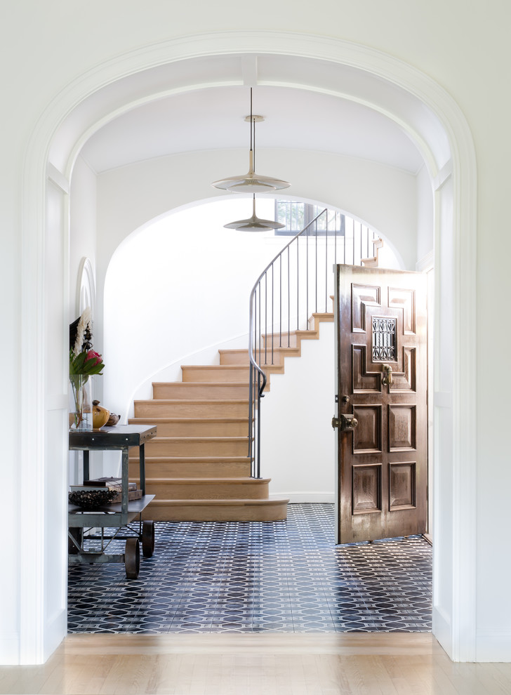 Design ideas for a transitional foyer in San Francisco with white walls, a single front door, a dark wood front door and blue floor.