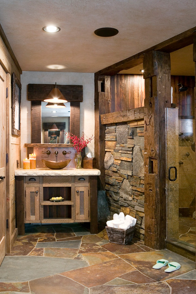 Example of a mountain style brown tile and slate tile bathroom design in Sacramento with a vessel sink, shaker cabinets, beige walls and distressed cabinets