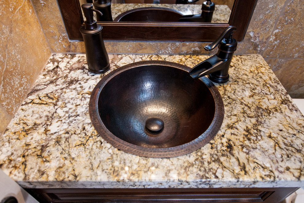Mid-sized traditional 3/4 bathroom in Phoenix with an undermount sink, dark wood cabinets, granite benchtops, a two-piece toilet, beige tile, blue walls and travertine floors.