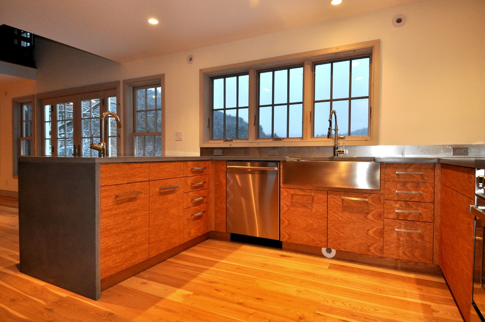 Open concept kitchen - large transitional l-shaped light wood floor and beige floor open concept kitchen idea in Boston with a farmhouse sink, flat-panel cabinets, dark wood cabinets, stainless steel countertops, stainless steel appliances and no island