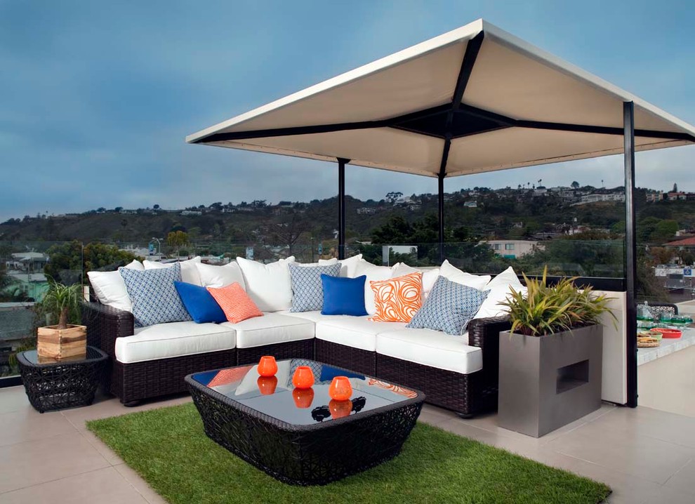 Design ideas for a large modern patio in San Diego with an outdoor kitchen and an awning.