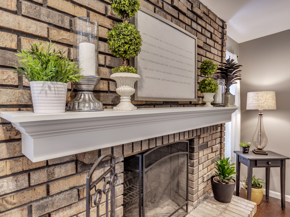 Eat-in kitchen - mid-sized transitional u-shaped brown floor eat-in kitchen idea in St Louis with white cabinets, granite countertops, white backsplash, subway tile backsplash, stainless steel appliances, an island and multicolored countertops