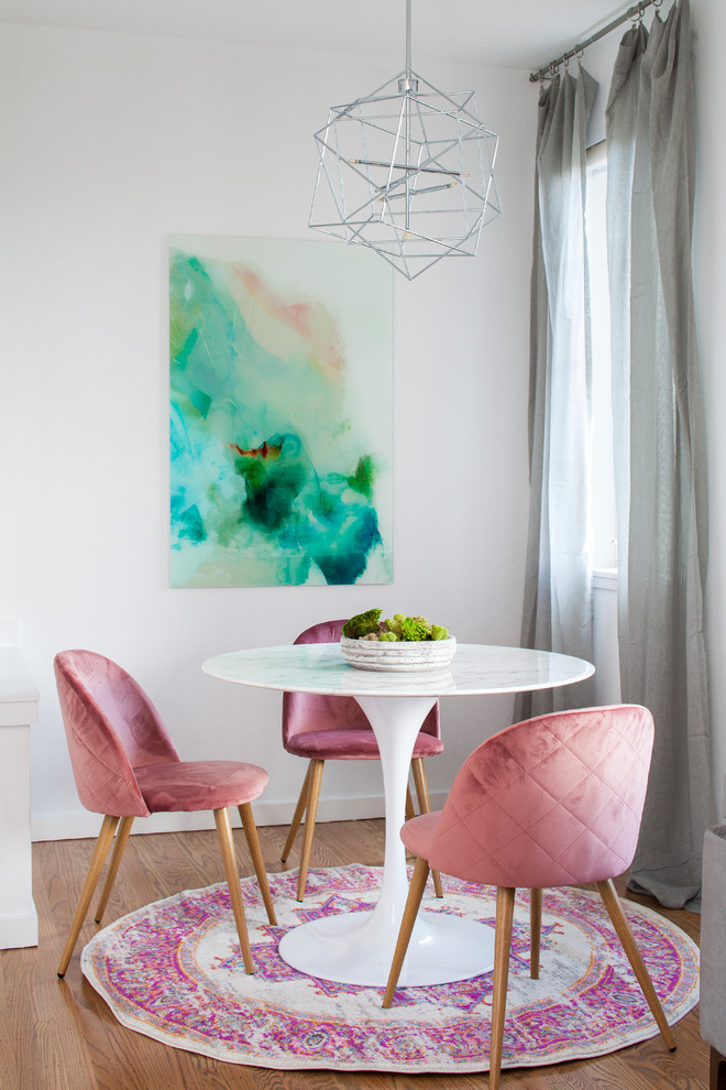 This is an example of a small eclectic open plan dining in San Francisco with white walls.