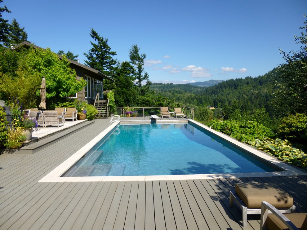 This is an example of a country rectangular pool in Seattle with decking.