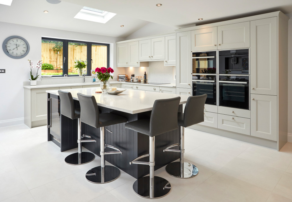 This is an example of a transitional kitchen in Surrey.