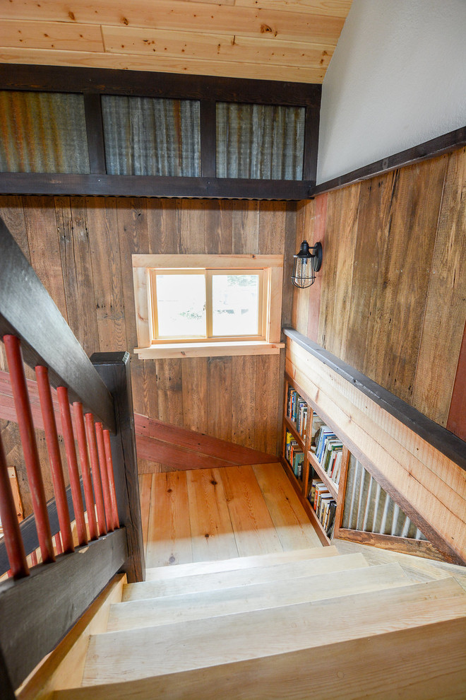 This is an example of a mid-sized country wood l-shaped staircase in Other with wood risers.