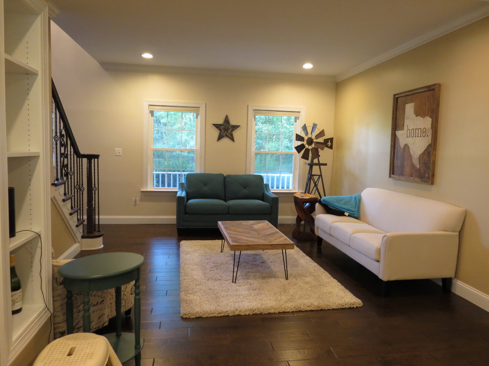 Inspiration for a large transitional galley dark wood floor and brown floor kitchen remodel with a double-bowl sink, raised-panel cabinets, white cabinets, granite countertops, white backsplash, porcelain backsplash, stainless steel appliances and an island