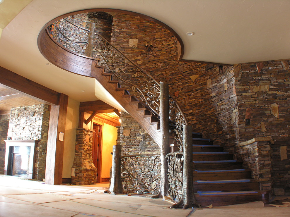 Example of a mountain style home design design in Denver