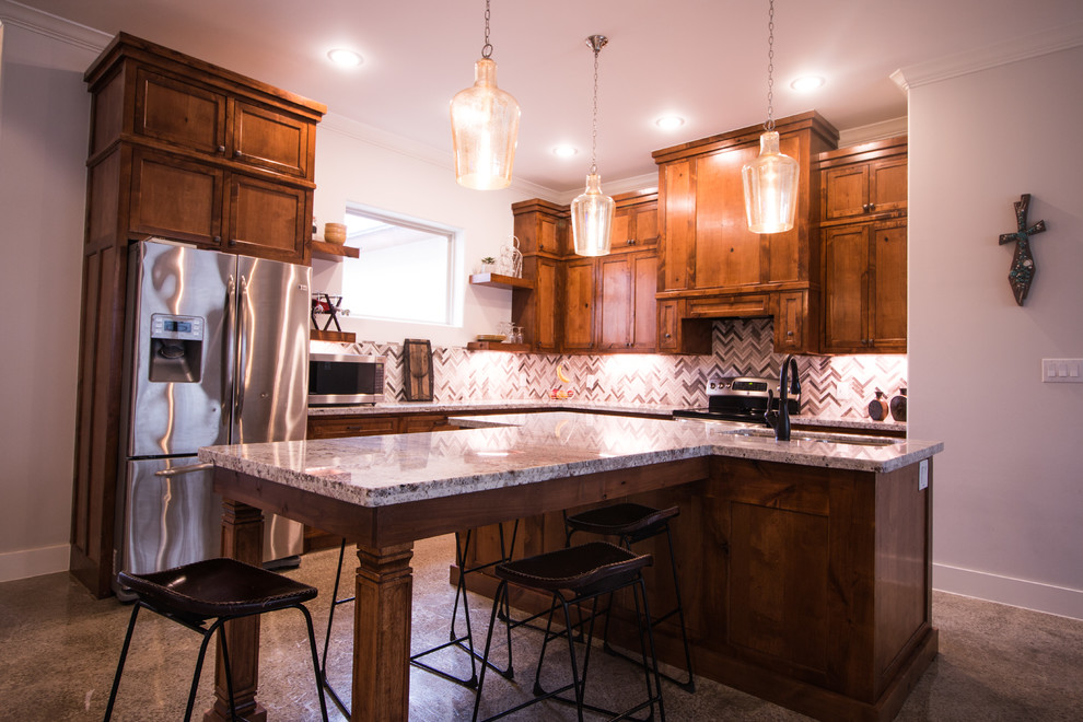 Eat-in kitchen - mid-sized rustic l-shaped concrete floor and gray floor eat-in kitchen idea with a double-bowl sink, shaker cabinets, granite countertops, gray backsplash, mosaic tile backsplash, stainless steel appliances and an island
