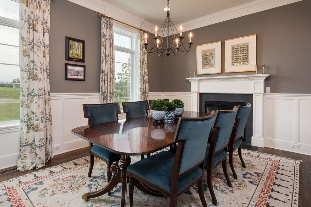 Design ideas for a mid-sized traditional separate dining room in Other with brown walls, dark hardwood floors, a standard fireplace, a concrete fireplace surround and brown floor.