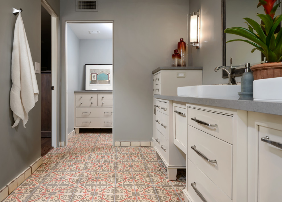 Inspiration for a large transitional master multicolored tile and terra-cotta tile terra-cotta tile alcove shower remodel in Phoenix with beaded inset cabinets, beige cabinets, gray walls, a vessel sink and quartz countertops