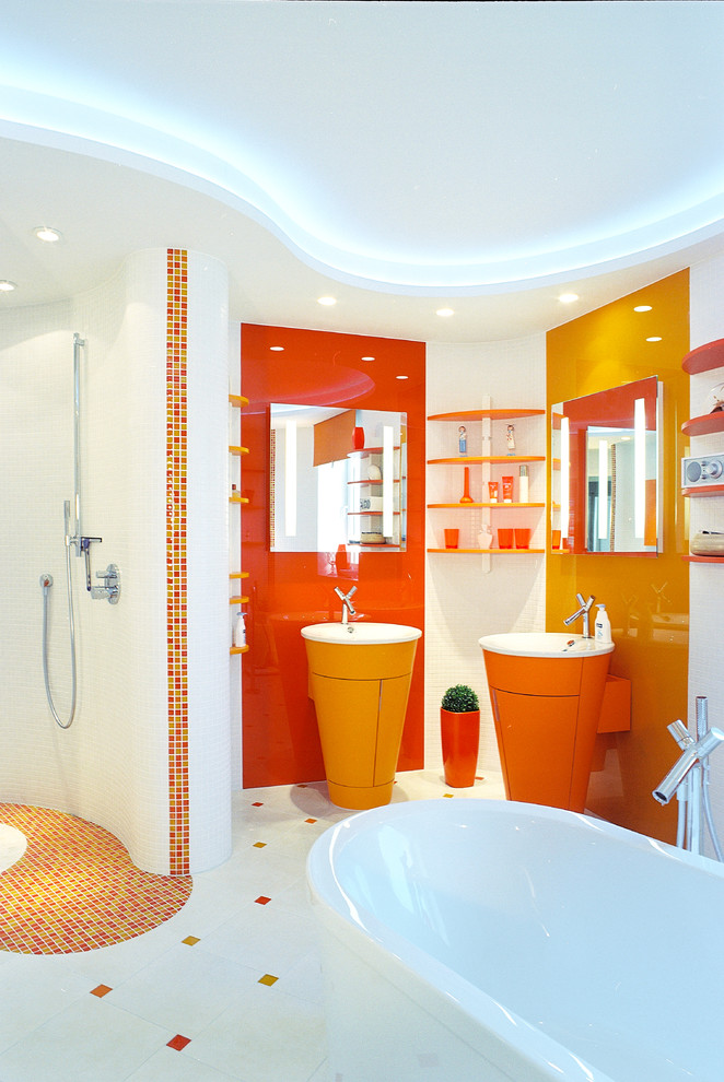 Inspiration for a mid-sized contemporary master bathroom in Berlin with a drop-in tub, a wall-mount toilet, a trough sink, an open shower, orange tile, white tile, mosaic tile, white walls, an open shower, flat-panel cabinets, orange cabinets and white floor.