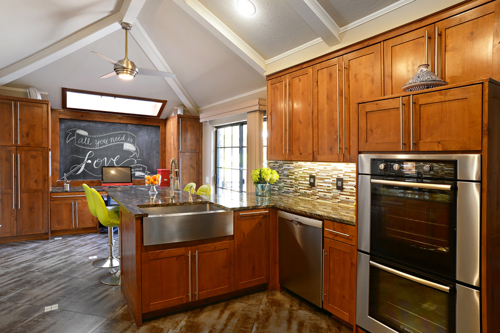 Inspiration for a large transitional u-shaped travertine floor eat-in kitchen remodel in Dallas with a farmhouse sink, medium tone wood cabinets, granite countertops, multicolored backsplash, matchstick tile backsplash, stainless steel appliances and a peninsula